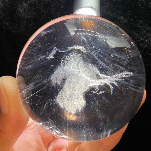 White cloud shaped like a small figure inside the smoky quartz