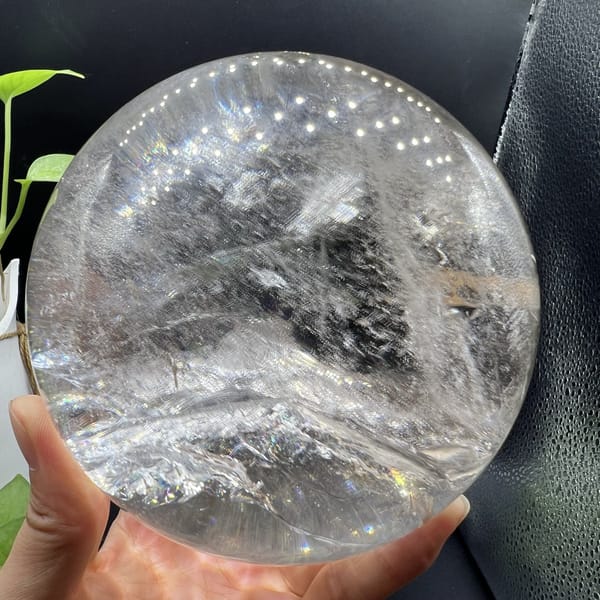 Snowfield-like veils rising in the clear quartz with grey depths above