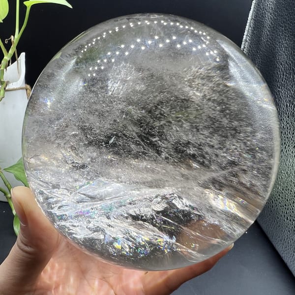 Glacier-like band of veils under the glassy dome of the sphere