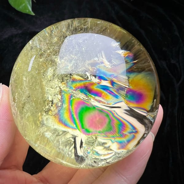 Bullseye rainbow with a pink core near the lower right of the sphere