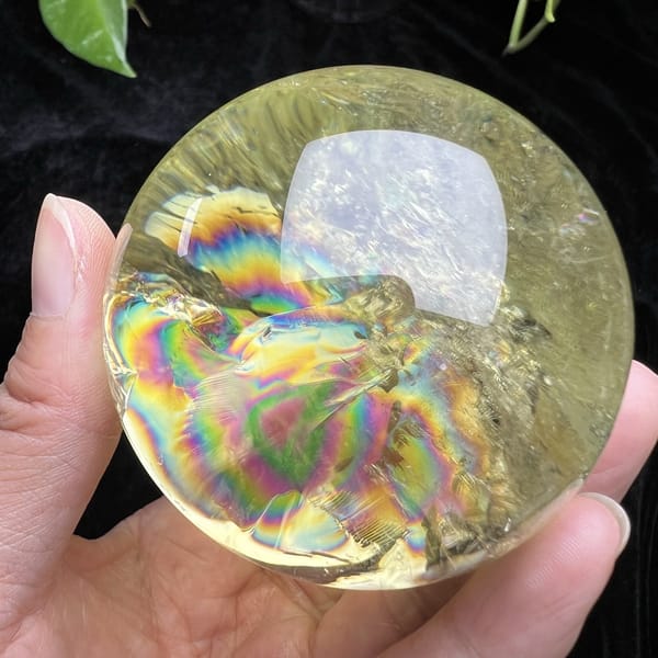 Broad rainbow flare running across the lower half of the citrine