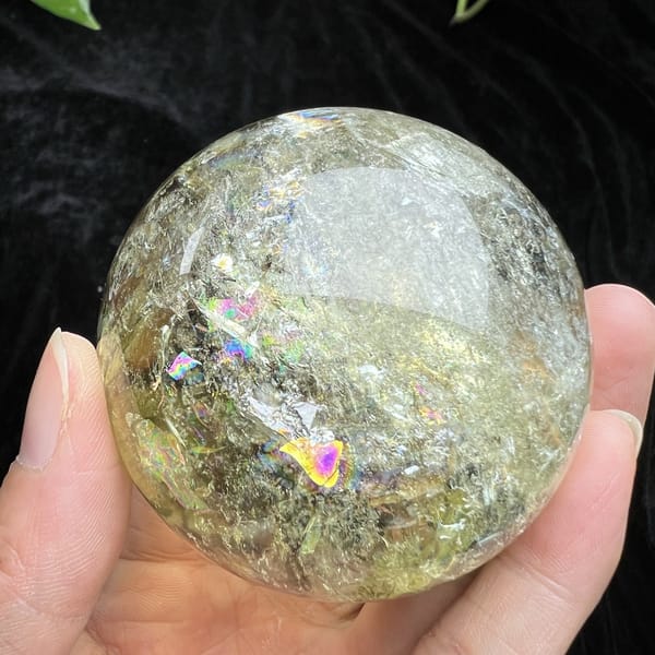 Cloudier underside of the sphere with tiny pink rainbow flashes