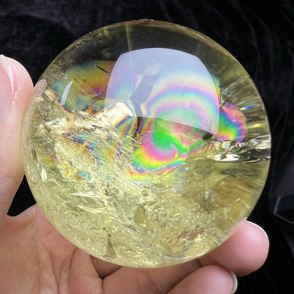 Rainbow arc near the top with sparkling veils below inside the citrine