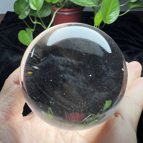 Second view through the clear sphere with a few white specks inside