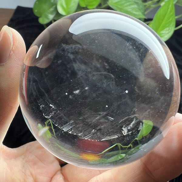 Silky streak layer glinting through the clear sphere from a lower angle