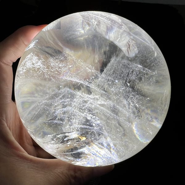 Phantom ridges crossing the sphere diagonally with clear quartz above