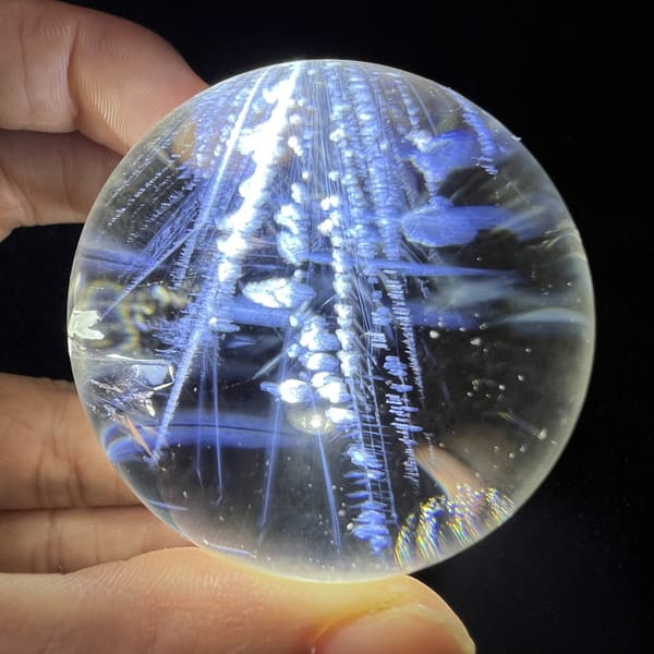Repeat of the beaded strand view with blue needles lit from below