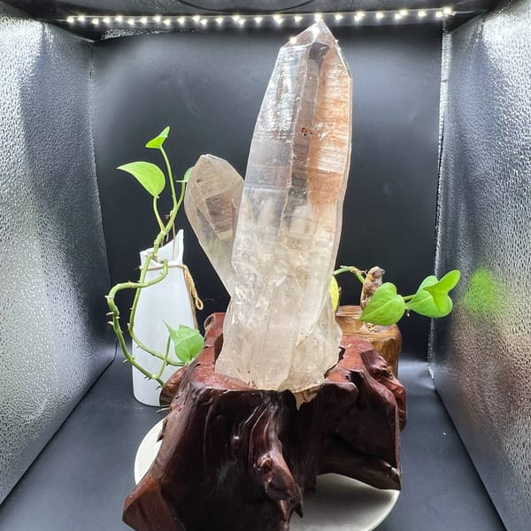 Tall quartz point with horizontal striations visible along its faces