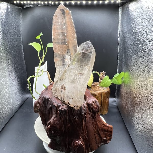 Narrow profile of the main point standing above the smaller crystal