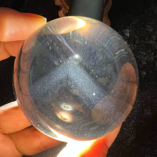 Silver dust phantom shaped like a mountain roof seen through clear quartz