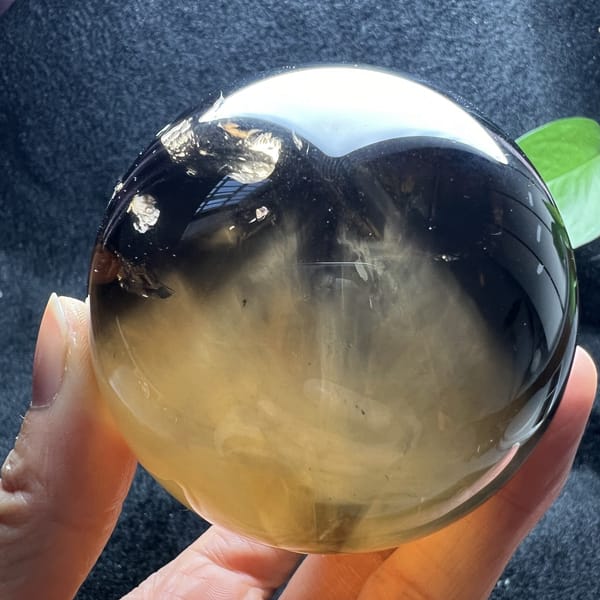 Smoky citrine with the white needle mountain rising toward the top