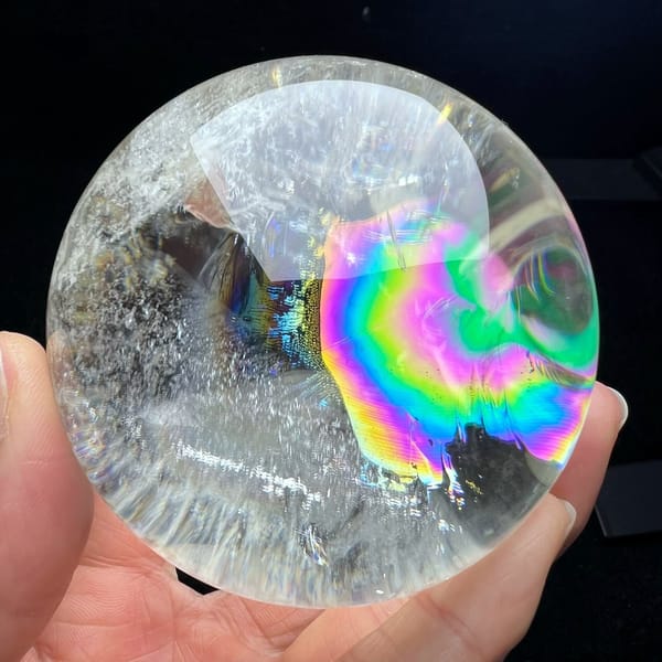 Large green and pink rainbow filling the right half of the sphere