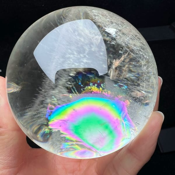 Pink and green bullseye rainbow below the top reflection