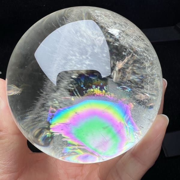Bullseye rainbow rings sitting low in the pale quartz