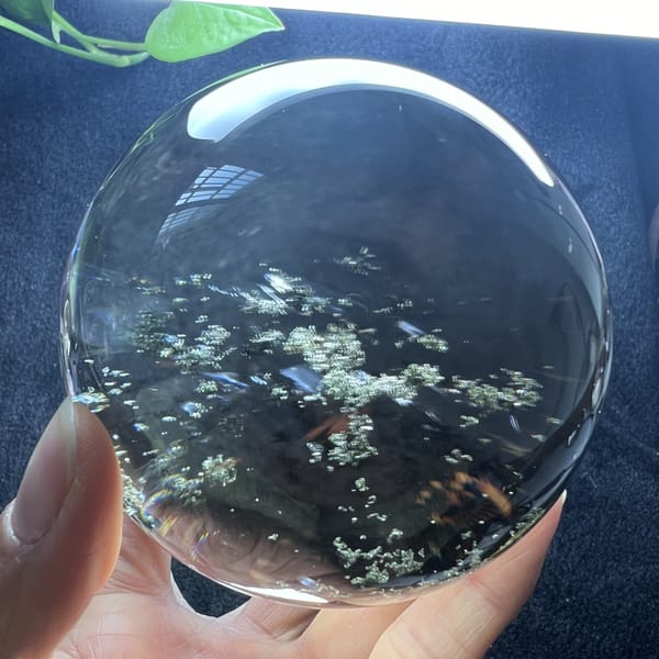 Starry green clusters floating at different depths in the sphere