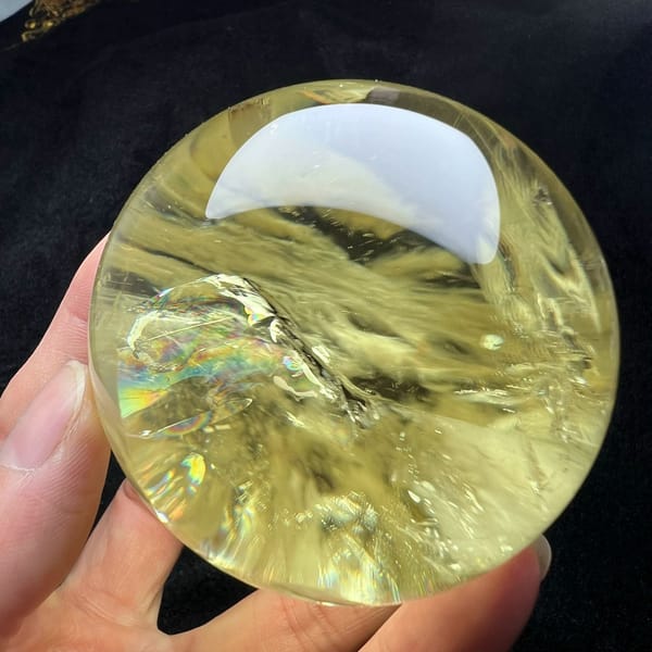Pale yellow citrine with veils and faint rainbow planes inside