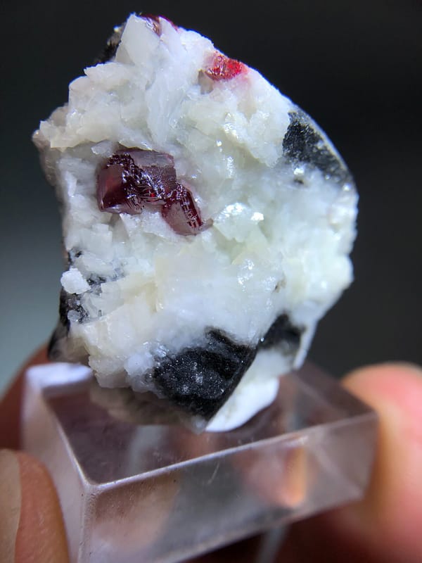 Red Cinnabar Crystals within White Dolomite Growth