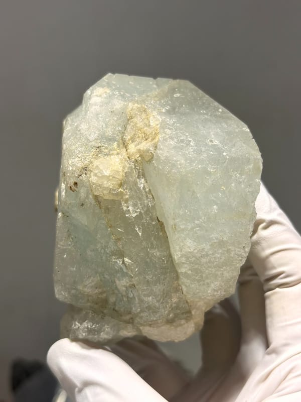 Large single aquamarine crystal with unusual etched pattern from Sichuan, China, detail of the matrix contact