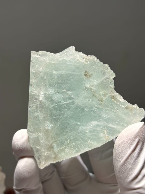 Etched aquamarine plate from Xuebaoding, Sichuan, China, close-up of the crystal faces