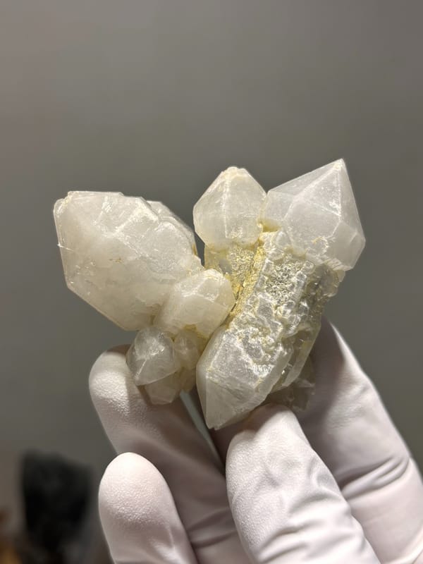 White sketch-pattern quartz cluster from Yunnan, China, close-up of the crystal faces