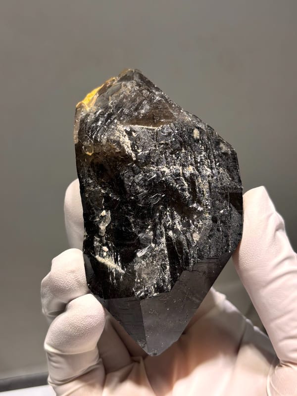 Dark smoky quartz floater from Fujian, China, close-up of the crystal faces