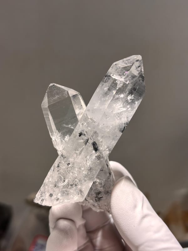 Two crossed clear quartz points with complete tips from Jinkouhe, Sichuan, China, second angle