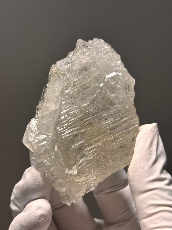 Skeletal quartz floater with sculpted faces from Jinkouhe, Sichuan, China, close-up of the crystal faces