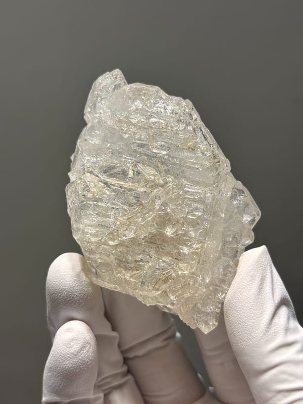 Skeletal quartz floater with sculpted faces from Jinkouhe, Sichuan, China, reverse side