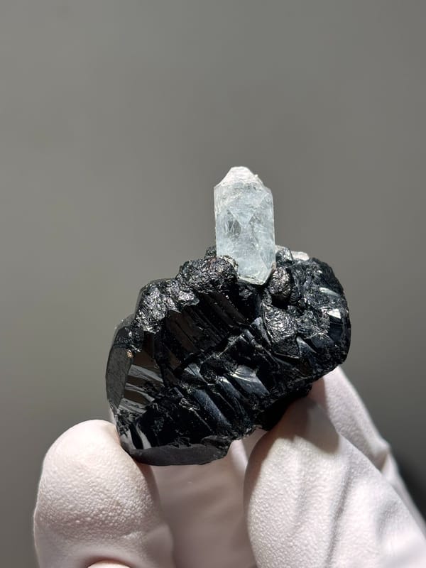 Pale aquamarine on black cassiterite from Xuebaoding, Sichuan, China, second angle