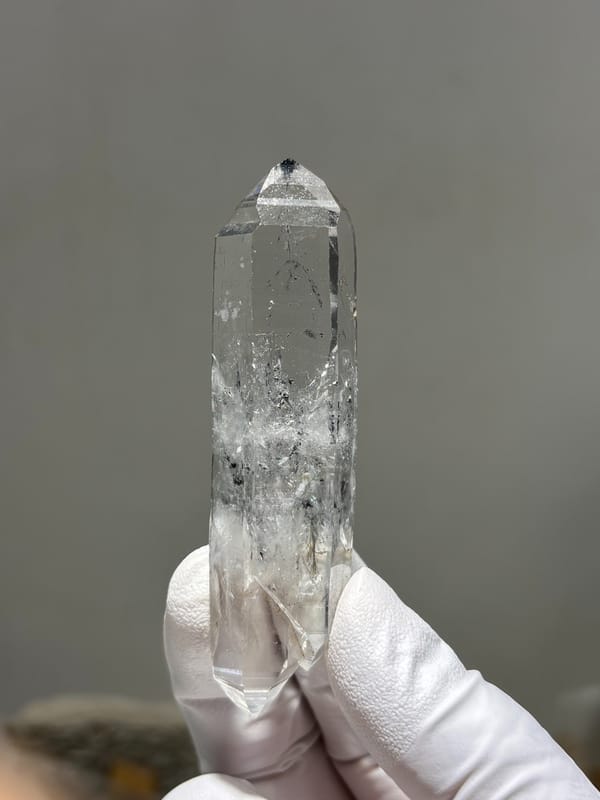 Double-terminated quartz with black inclusions from Jinkouhe, Sichuan, China, close-up of the crystal faces