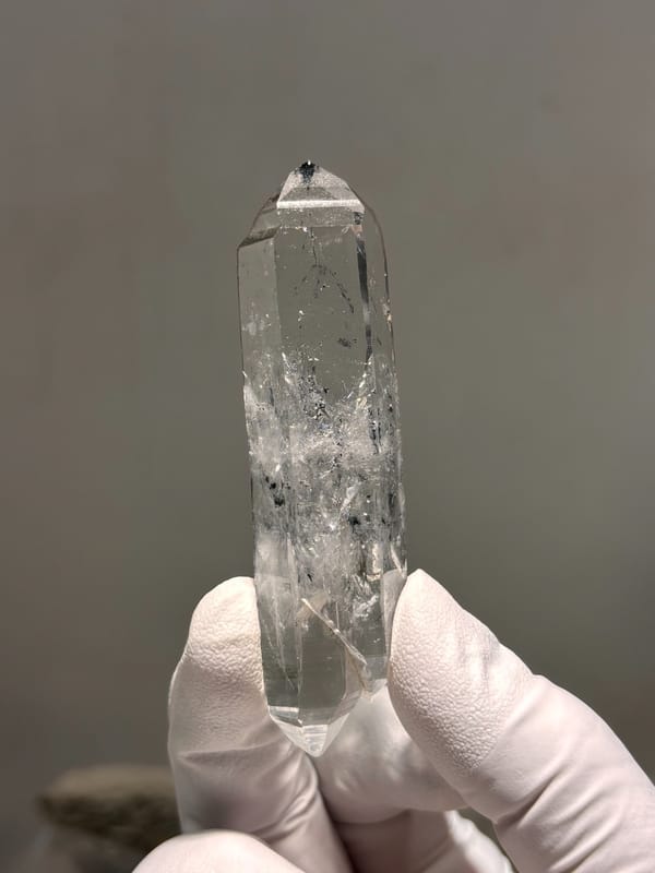 Double-terminated quartz with black inclusions from Jinkouhe, Sichuan, China, reverse side