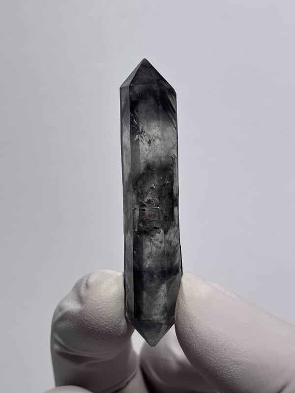 Dark smoky double-terminated quartz wand from Yunnan, China, top view
