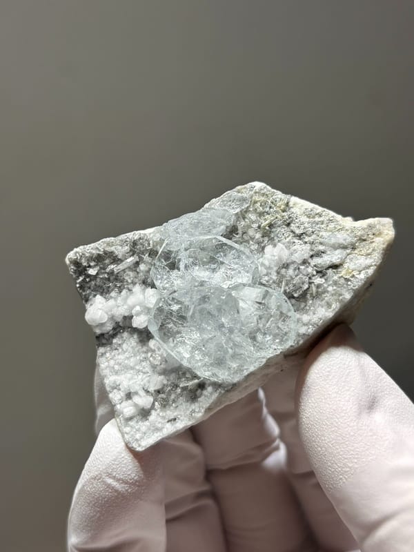 Heart-shaped aquamarine on white feldspar from Xuebaoding, Sichuan, China, second angle