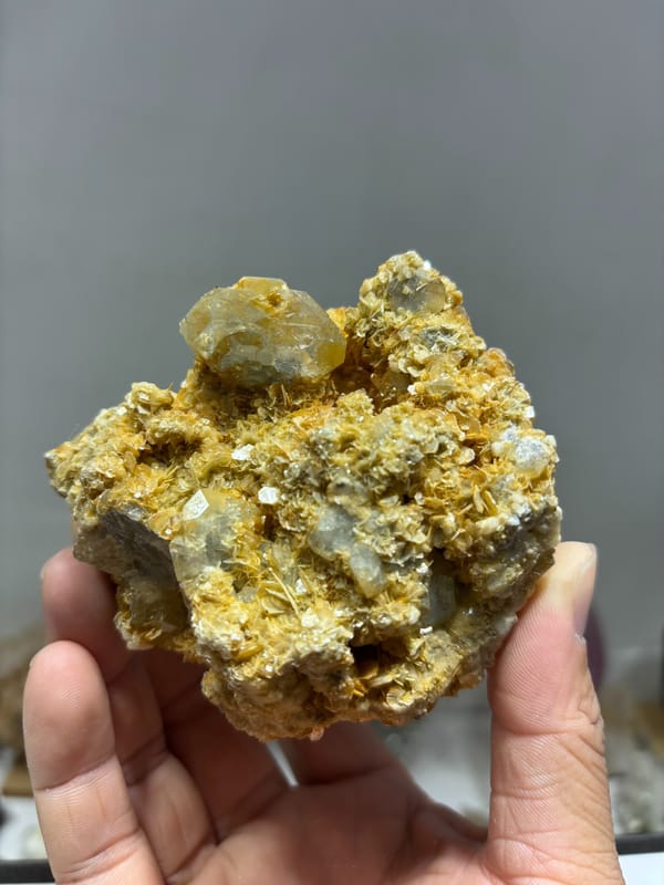 Pale aquamarine in golden mica with natural hollow from Xuebaoding, Sichuan, China, second angle