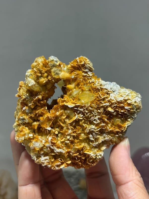 Pale aquamarine in golden mica with natural hollow from Xuebaoding, Sichuan, China, reverse side