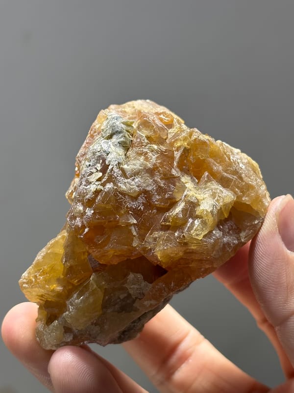 Large honey-orange scheelite crystal from Xuebaoding, Sichuan, China, reverse side