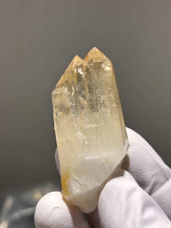 Pale golden cathedral quartz point from Xuebaoding, Sichuan, China, close-up of the crystal faces