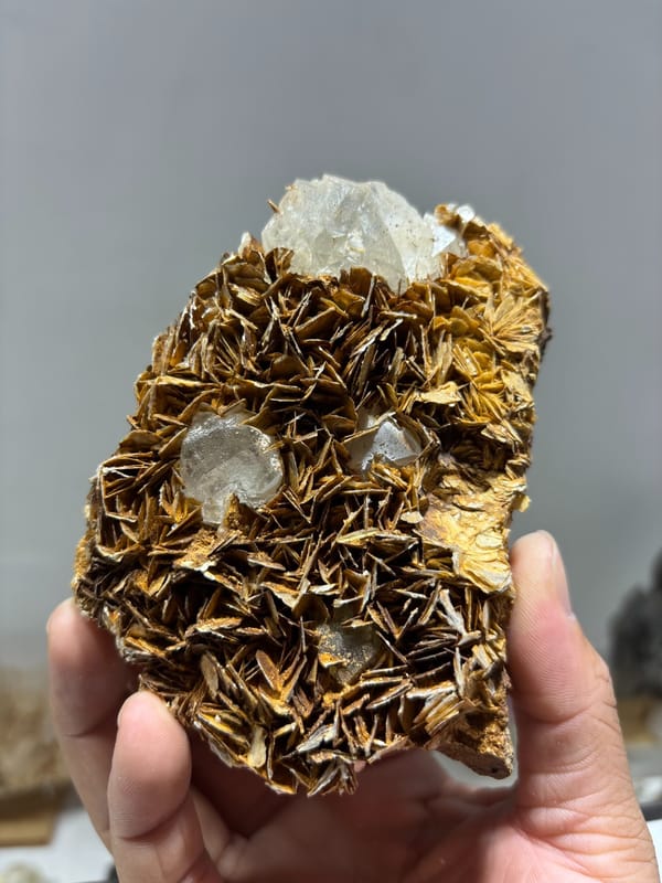 Clear fluorite cubes set in plate of golden mica blades from Xuebaoding, Sichuan, China, second angle