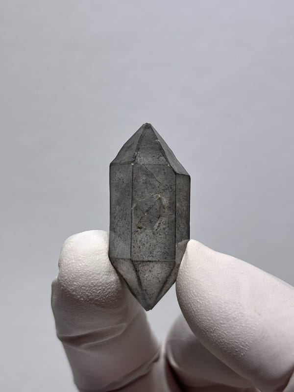 Stout grey sketch-pattern double-terminated quartz from Yunnan, China, close-up of the crystal faces
