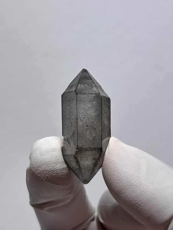 Stout grey sketch-pattern double-terminated quartz from Yunnan, China, reverse side