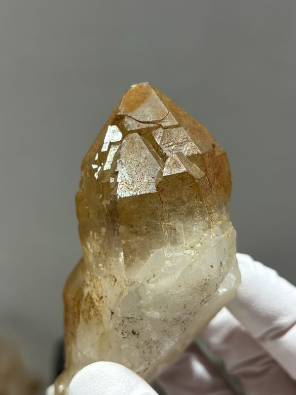 Golden quartz point with sculpted form from Xuebaoding, Sichuan, China, second angle