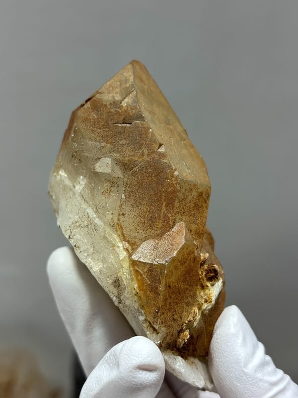 Golden quartz point with sculpted form from Xuebaoding, Sichuan, China, top view