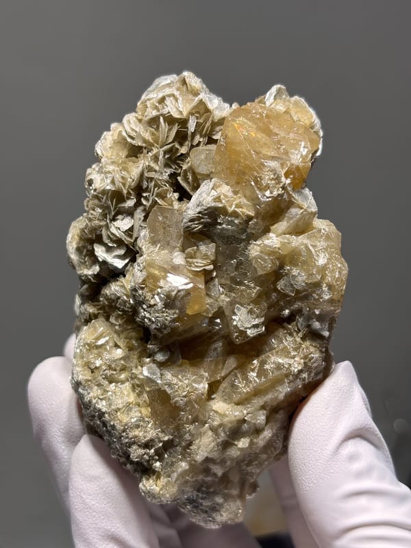 Pale yellow scheelite plate with golden mica from Xuebaoding, Sichuan, China, reverse side