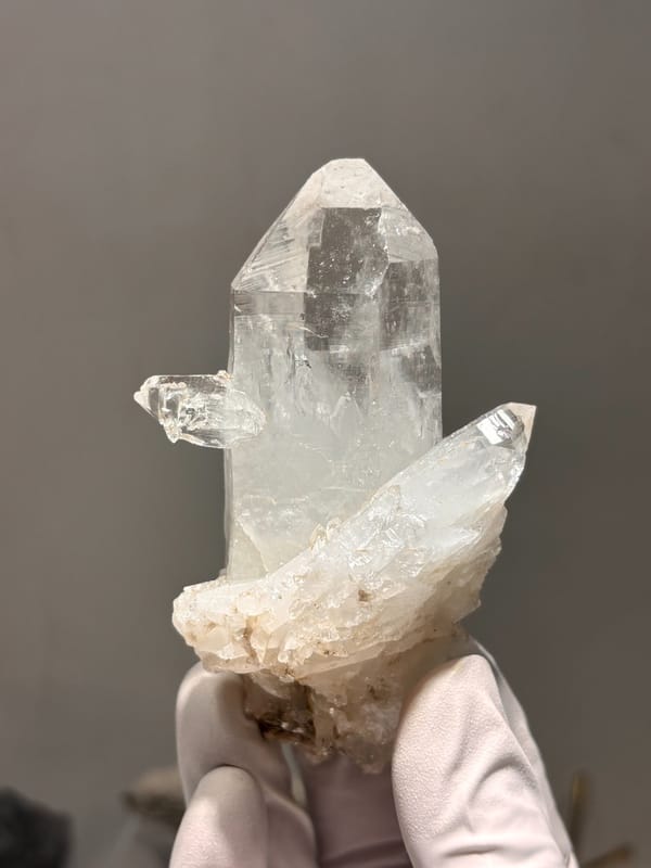 Clear quartz point on white cluster from Xuebaoding, Sichuan, China, reverse side