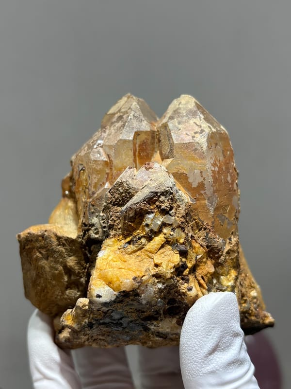 Tan cathedral quartz cluster on golden matrix from Xuebaoding, Sichuan, China, second angle