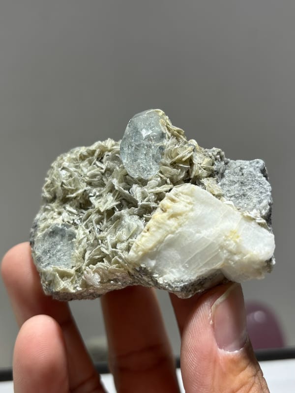 Mica plate with aquamarine on both faces and feldspar from Xuebaoding, Sichuan, China, second angle