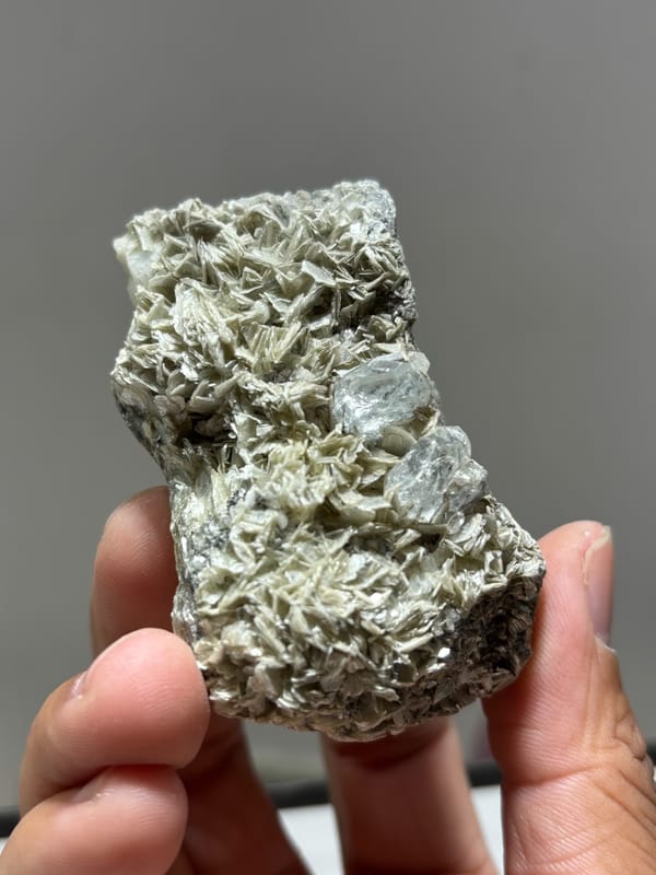 Mica plate with aquamarine on both faces and feldspar from Xuebaoding, Sichuan, China, top view