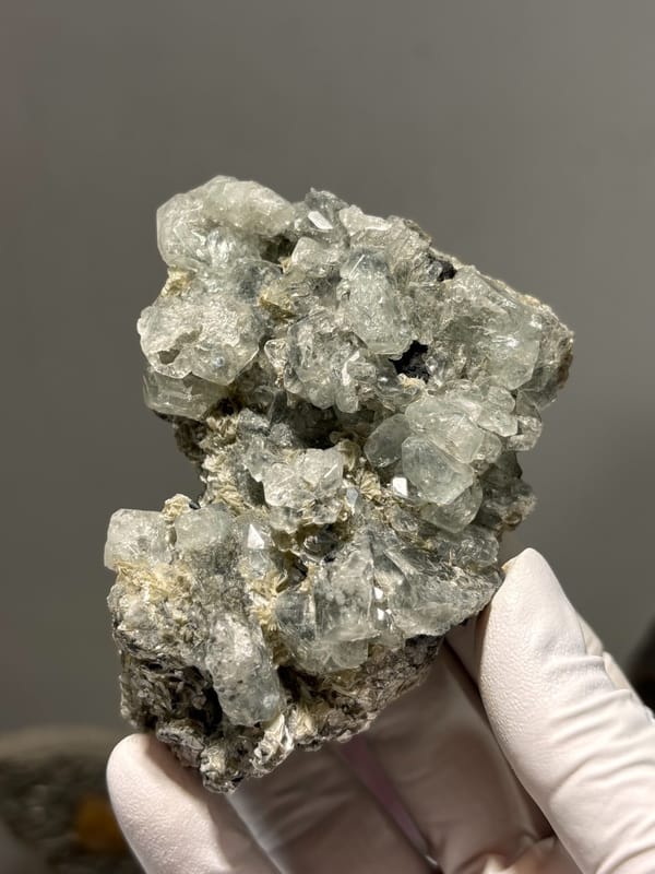 Cluster of pale green aquamarine crystals on dark mica from Xuebaoding, Sichuan, China, second angle