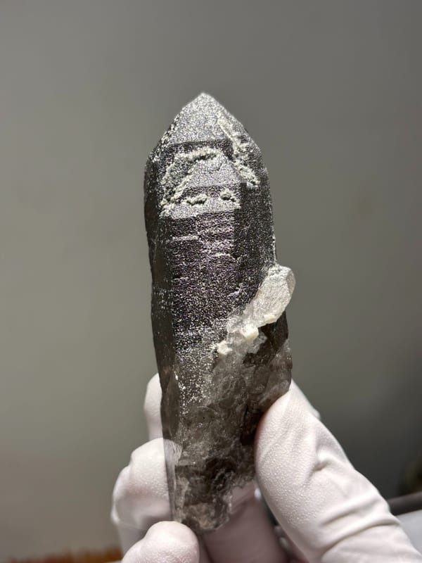Dark smoky quartz point with complete tip from Fujian, China, reverse side