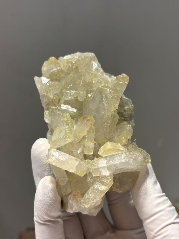 Plate of pale yellow baryte crystals from Jinkouhe, Sichuan, China, close-up of the crystal faces